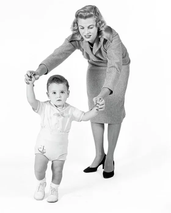 Framed Print : 1950s 1960s CONCERNED PROUD MOTHER WATCHING HELPING BABY BOY TAKING FIRST STEPS WALKING LOOKING AT CAMERA Framed Print : 1950s 1960s CONCERNED PROUD MOTHER WATCHING HELPING BABY BOY TAKING FIRST STEPS WALKING LOOKING AT CAMERA