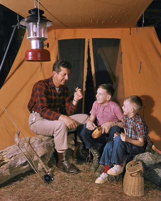 Framed Print : 1950s 1960s MAN FATHER SMOKING PIPE SITTING BY FISHING CAMPING TENT WITH TWO BOYS SONS TELLING STORIES OUTDOORS AT NIGHT Framed Print : 1950s 1960s MAN FATHER SMOKING PIPE SITTING BY FISHING CAMPING TENT WITH TWO BOYS SONS TELLING STORIES OUTDOORS AT NIGHT