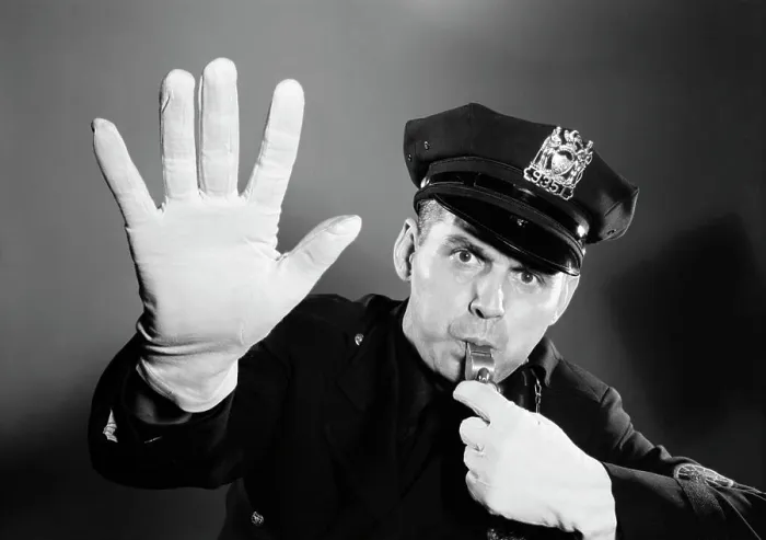 Framed Print : 1950s 1960s POLICE MAN LOOKING AT CAMERA HAT WITH BADGE BLOWING WHISTLE WHITE GLOVED HAND UP TO HALT STOP TRAFFIC Framed Print : 1950s 1960s POLICE MAN LOOKING AT CAMERA HAT WITH BADGE BLOWING WHISTLE WHITE GLOVED HAND UP TO HALT STOP TRAFFIC