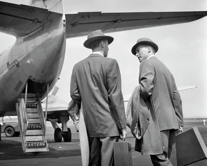 Framed Print : 1950s TWO BUSINESSMEN TALKING ON TARMAC ABOUT TO ENTER REAR DOORS OF EASTERN AIRLINES PASSENGER PLANE Framed Print : 1950s TWO BUSINESSMEN TALKING ON TARMAC ABOUT TO ENTER REAR DOORS OF EASTERN AIRLINES PASSENGER PLANE