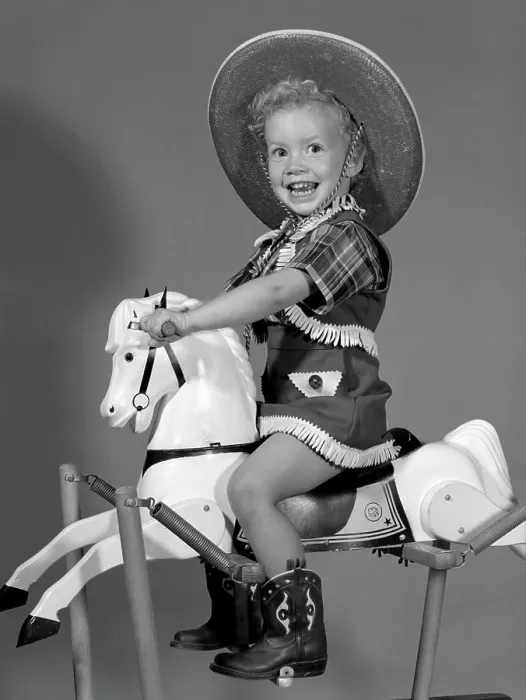 Framed Print : 1950S Girl Dressed As Cowgirl Riding Rocking Horse Framed Print : 1950S Girl Dressed As Cowgirl Riding Rocking Horse