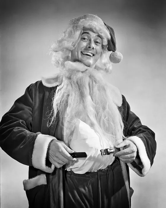 Framed Print : 1950s SMILING MAN DRESSING UP IN SANTA COSTUME HOLDING BELT AROUND PADDED STOMACH Framed Print : 1950s SMILING MAN DRESSING UP IN SANTA COSTUME HOLDING BELT AROUND PADDED STOMACH