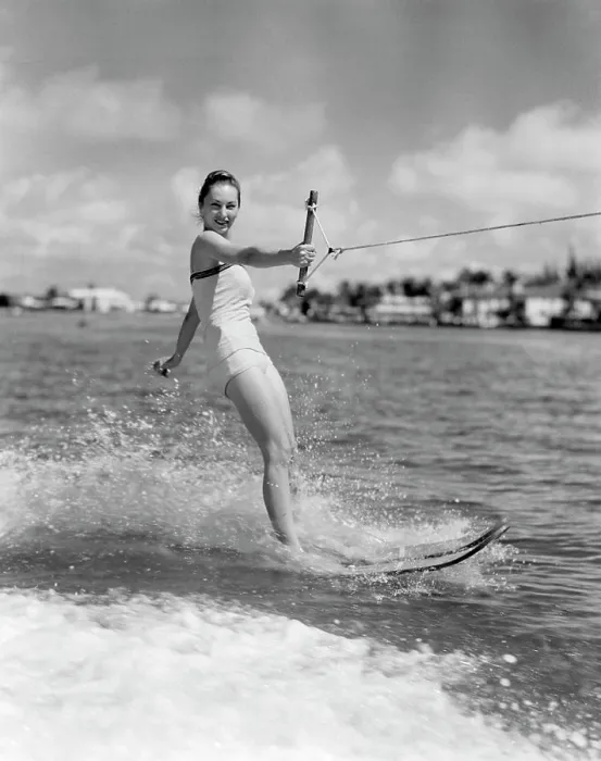 Framed Print : 1950S Smiling Woman In Bathing Suit Water Skiing Waving One Hand Framed Print : 1950S Smiling Woman In Bathing Suit Water Skiing Waving One Hand