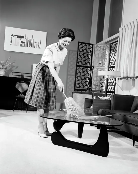 Framed Print : 1950S Woman Wearing A White Blouse & Plaid Skirt Dusting With A Feather Duster A Glass Top Coffee Table Framed Print : 1950S Woman Wearing A White Blouse & Plaid Skirt Dusting With A Feather Duster A Glass Top Coffee Table