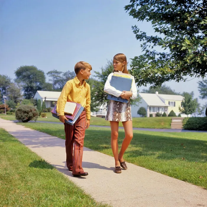 Framed Print : 1960s 1970s BOY GIRL ON SIDEWALK WALKING HOME FROM OR TO SCHOOL TALKING CARRYING BOOKS GIRL WEARING FAUX SNAKESKIN MINI Framed Print : 1960s 1970s BOY GIRL ON SIDEWALK WALKING HOME FROM OR TO SCHOOL TALKING CARRYING BOOKS GIRL WEARING FAUX SNAKESKIN MINI