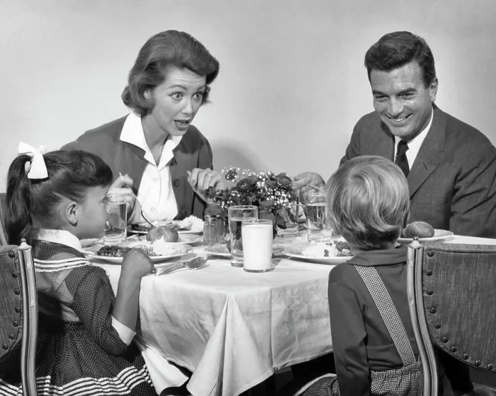 Framed Print : 1960s FAMILY OF FOUR EATING DINNER TOGETHER