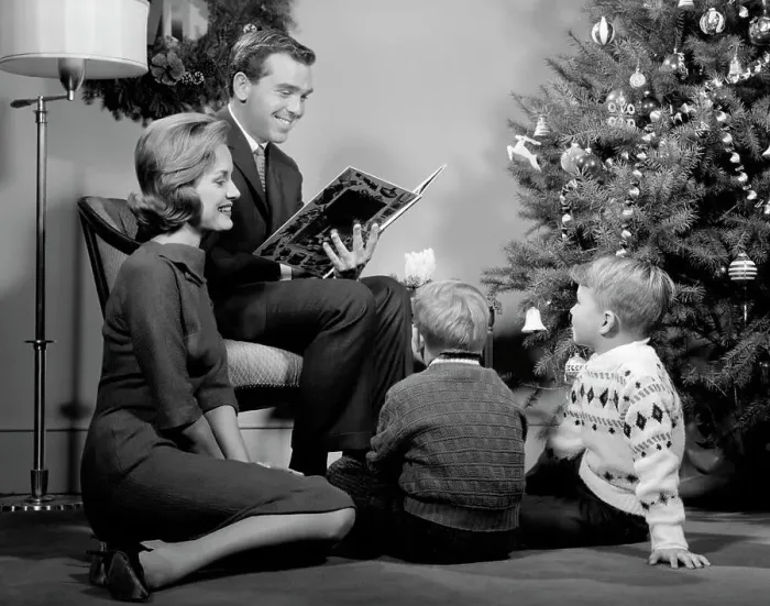 Framed Print : 1960S Family Father Mother Two Sons Smiling Sitting By Christmas Tree In Living Room Reading A Book