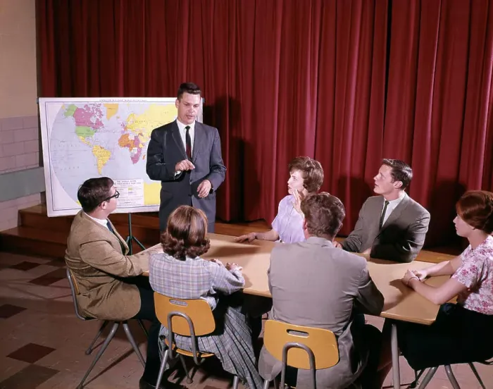 Framed Print : 1960S Group Of Students Around Table Teacher Standing By Map Framed Print : 1960S Group Of Students Around Table Teacher Standing By Map