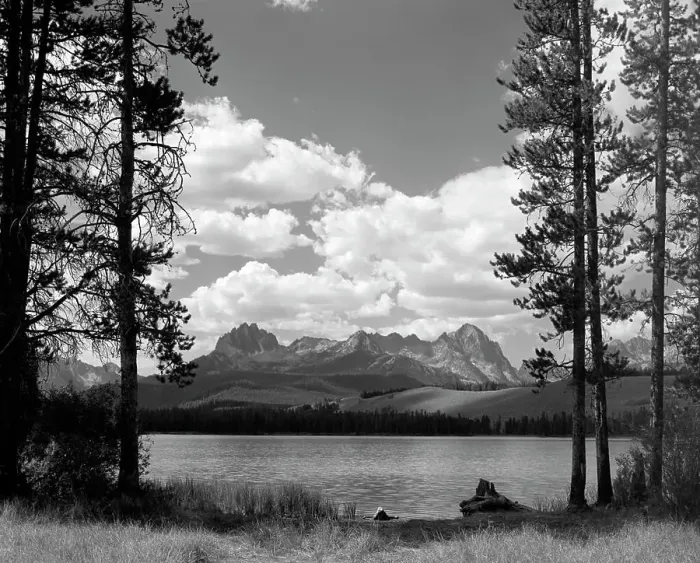 Framed Print : 1960S Little Red Fish Lake In Idaho With Saw Tooth Mountains In Background Viewed Between Clearing In Trees