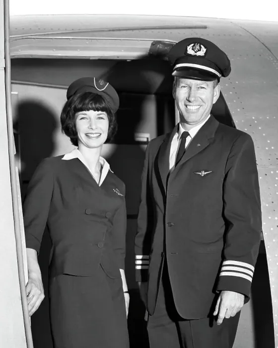 Framed Print : 1960s MAN CO-PILOT AND WOMAN FLIGHT ATTENDANT STANDING SMILING IN DOOR OF AIRPLANE LOOKING AT CAMERA Framed Print : 1960s MAN CO-PILOT AND WOMAN FLIGHT ATTENDANT STANDING SMILING IN DOOR OF AIRPLANE LOOKING AT CAMERA