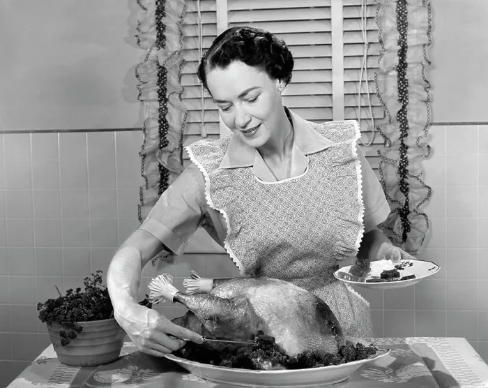 Framed Print : 1960S Woman In Apron Dishing Cranberry Sauce Out Around Turkey