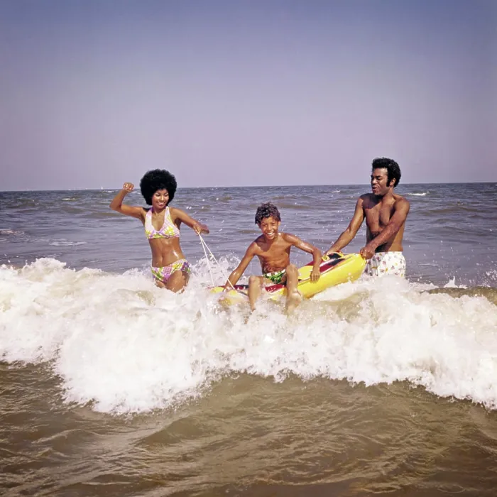 Framed Print : 1970s AFRICAN-AMERICAN FAMILY JUMPING IN OCEAN SEASHORE SURF MOTHER AND FATHER WITH SON ON INFLATABLE RAFT Framed Print : 1970s AFRICAN-AMERICAN FAMILY JUMPING IN OCEAN SEASHORE SURF MOTHER AND FATHER WITH SON ON INFLATABLE RAFT