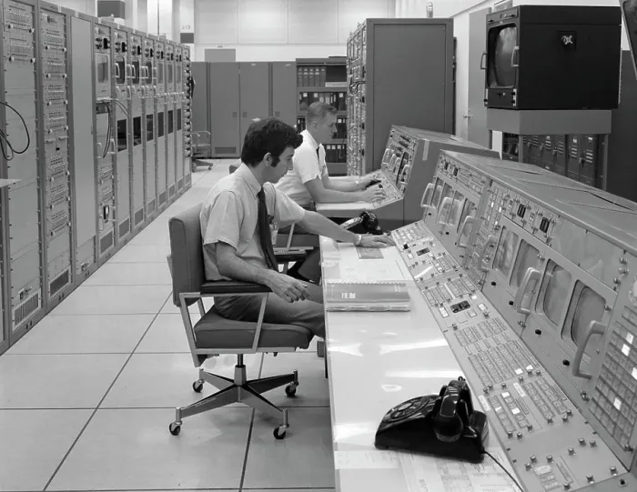 Framed Print : 1970S Two Men Sitting At Console Computer Room Mission Control Center Houston Texas Usa Framed Print : 1970S Two Men Sitting At Console Computer Room Mission Control Center Houston Texas Usa