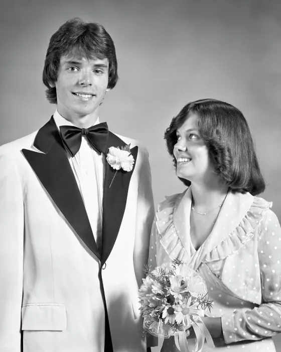 Framed Print : 1970s TEEN COUPLE DRESSED UP FOR PROM DANCE FORMAL ATTIRE GIRL HOLDING BOUQUET LOOKING UP AT TALL BOY