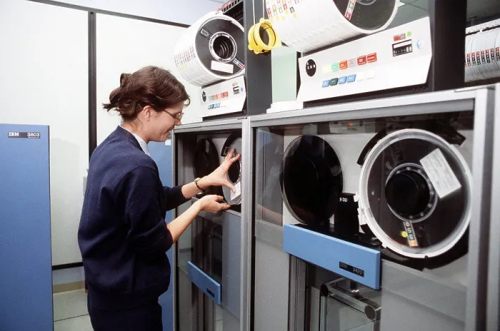 Framed Print : 1978 - A computer operator changes the tape on an IBM 370 / 168 computer at the 552nd Airborne Warning