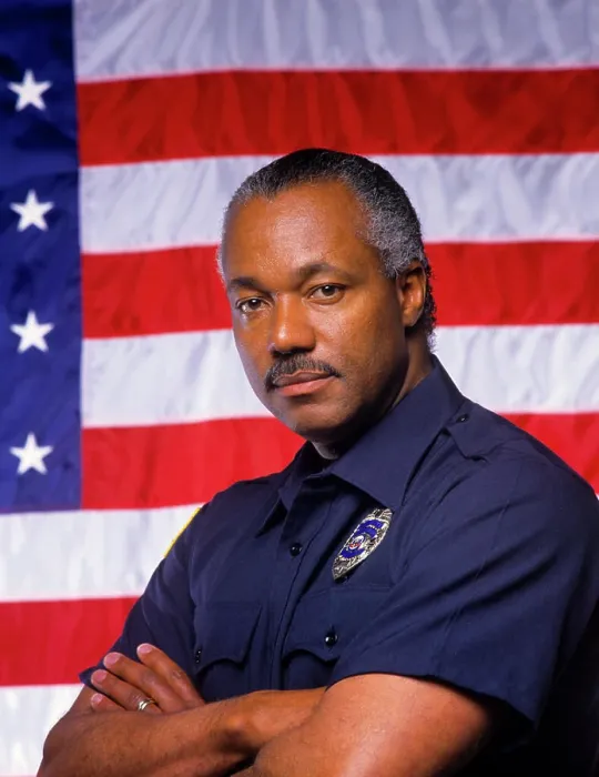 Framed Print : 1990s BLACK POLICEMAN LOOKING AT CAMERA STANDING IN FRONT OF U.S. FLAG Framed Print : 1990s BLACK POLICEMAN LOOKING AT CAMERA STANDING IN FRONT OF U.S. FLAG