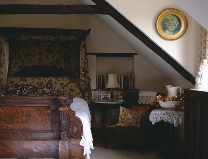 Framed Print : 19th-century carved half-tester bed with antique crewelwork hangings in attic country bedroom Framed Print : 19th-century carved half-tester bed with antique crewelwork hangings in attic country bedroom