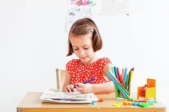 Framed Print : 5 year old girl in a classroom