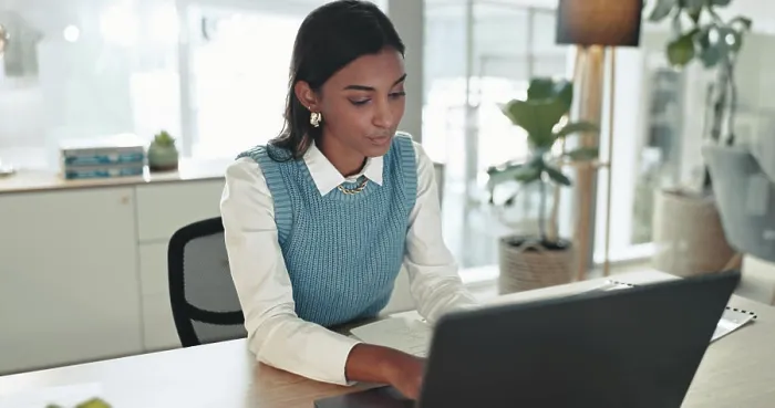Framed Print : Accounting, finance and laptop with business Indian woman at desk in office for bookkeeping report Framed Print : Accounting, finance and laptop with business Indian woman at desk in office for bookkeeping report