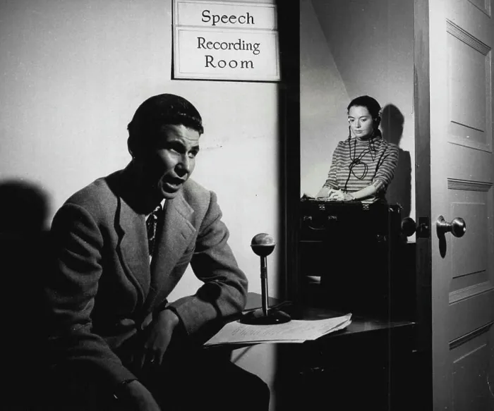 Framed Print : In adjoining room, Dr. Lois Rossignol records student's voice Framed Print : In adjoining room, Dr. Lois Rossignol records student's voice