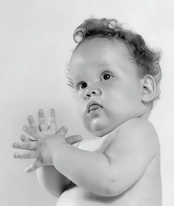 Framed Print : Adorable baby in black and white portrait with curly hair and curious expression Framed Print : Adorable baby in black and white portrait with curly hair and curious expression