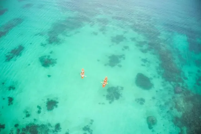 Framed Print : Aerial boat and people in ocean for kayak adventure Framed Print : Aerial boat and people in ocean for kayak adventure