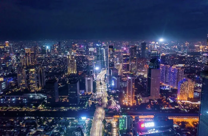 Framed Print : Aerial night cityscape of skyscrapers and multi lane highway traffic in modern city center of Jakarta Framed Print : Aerial night cityscape of skyscrapers and multi lane highway traffic in modern city center of Jakarta