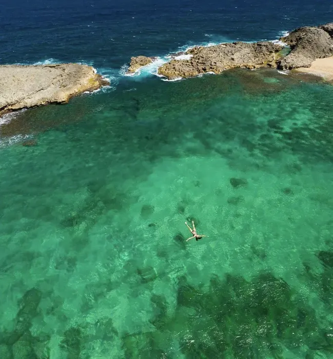 Framed Print : Aerial Shot of Girl Floating in Green Cove Framed Print : Aerial Shot of Girl Floating in Green Cove