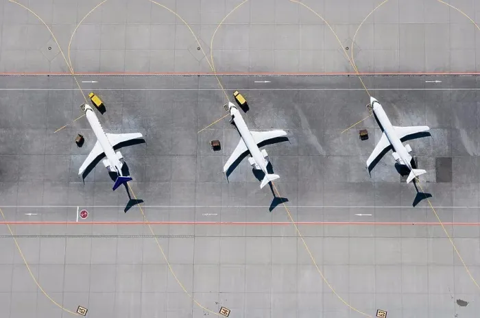 Framed Print : Aerial view of three airplanes in a row