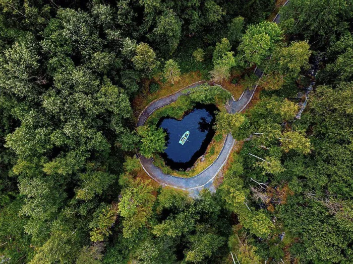 Framed Print : Aerial view of boat at underground lake in Ruskeala Mountain Park Framed Print : Aerial view of boat at underground lake in Ruskeala Mountain Park