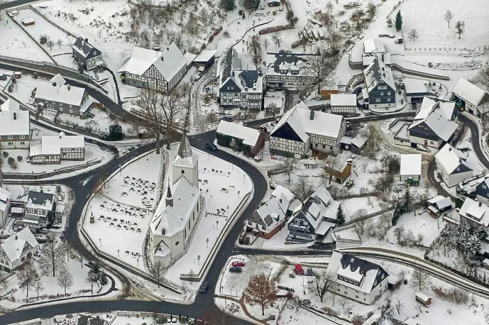Framed Print : Aerial view, Brunskappeler church in winter and Wildenberg castle