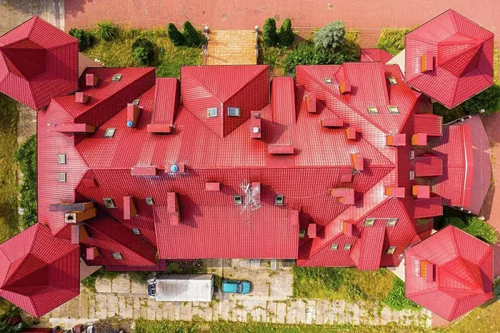 Framed Print : Top aerial view of building complex shingle roof construction. A Framed Print : Top aerial view of building complex shingle roof construction. A