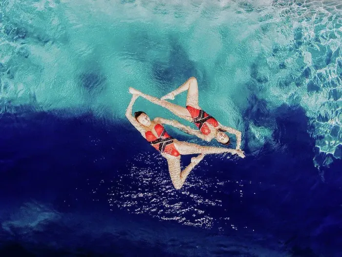 Framed Print : Aerial view of Caucasian synchronized swimmers