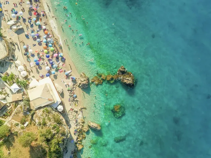 Framed Print : Aerial view of crowded beach with vacationers, parasols and resort, Lefkada, Greece Framed Print : Aerial view of crowded beach with vacationers, parasols and resort, Lefkada, Greece