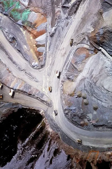 Framed Print : Aerial view of dump trucks on the road leading to the Grasberg Mine on the Jayawijaya Mountains Framed Print : Aerial view of dump trucks on the road leading to the Grasberg Mine on the Jayawijaya Mountains