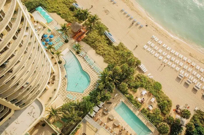 Framed Print : Aerial view of hotel pools and tropical beach Framed Print : Aerial view of hotel pools and tropical beach