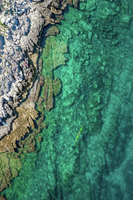 Framed Print : Aerial view of a kayak in the turquoise waters of Bale, Croatia Framed Print : Aerial view of a kayak in the turquoise waters of Bale, Croatia