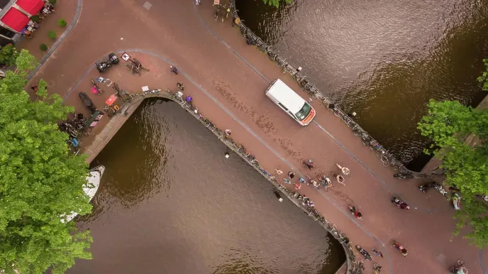 Framed Print : Aerial view of people cycling in Amsterdam city center, The Netherlands