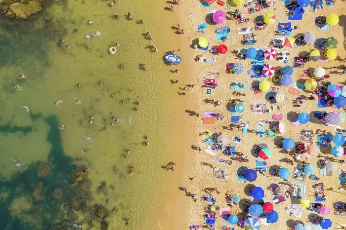 Framed Print : Aerial view above of people enjoying the summer at Praia do Camilo, Portugal Framed Print : Aerial view above of people enjoying the summer at Praia do Camilo, Portugal