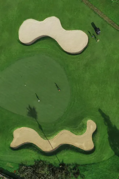 Framed Print : Aerial view of players at golf field