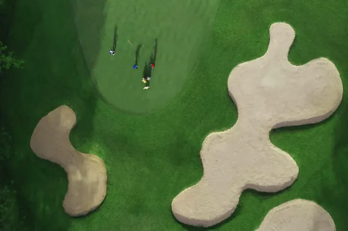 Framed Print : Aerial view of players at golf field