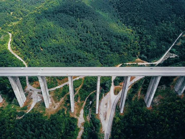 Framed Print : Aerial view of the road in the mountains over the bridge Aerial view of the road in the mountains over the bridge