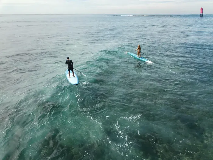 Framed Print : Aerial view of sup surfers