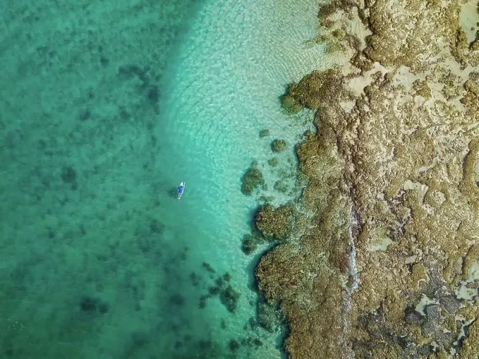 Framed Print : Aerial view of surfer, Sumbawa, Indonesia