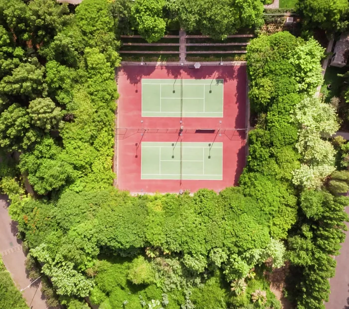 Framed Print : Aerial view of tennis courts in the middle of dense vegetation in Dubai, U.A.E Framed Print : Aerial view of tennis courts in the middle of dense vegetation in Dubai, U.A.E