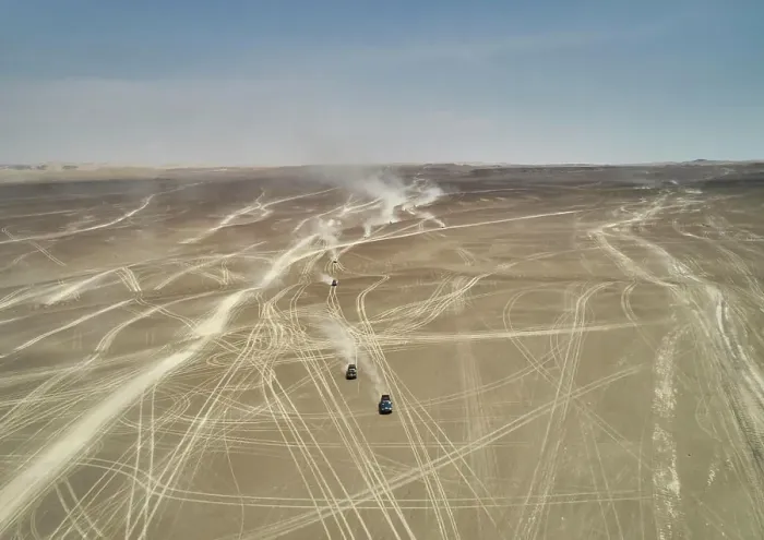 Framed Print : Aerial view of vehicular tracks crisscrossing a vast desert landscape