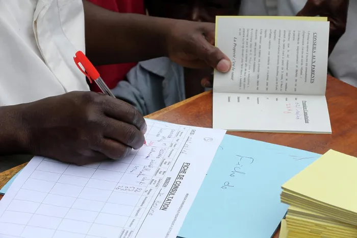 Framed Print : African paediatric hospital. Health. Child health record booklet. Togo