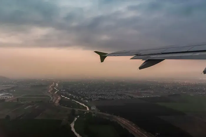 Framed Print : Airplane wing and aerial view of Punta Arenas city lights at dusk, Magallanes Region, Chile Framed Print : Airplane wing and aerial view of Punta Arenas city lights at dusk, Magallanes Region, Chile