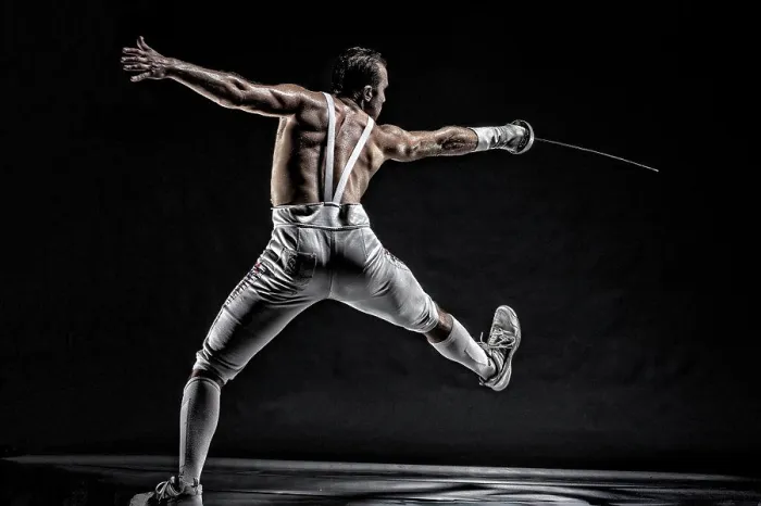 Framed Print : American World Champion and two time Olympic Fencer Soren Thompson against a dark background. Bodies in Action Framed Print : American World Champion and two time Olympic Fencer Soren Thompson against a dark background. Bodies in Action