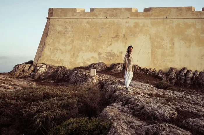 Framed Print : androgynous person stands in front of historic fort in Portugal Framed Print : androgynous person stands in front of historic fort in Portugal